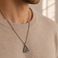 Viking Trinity cremation necklace worn by man — men's stainless steel memorial pendant for ashes