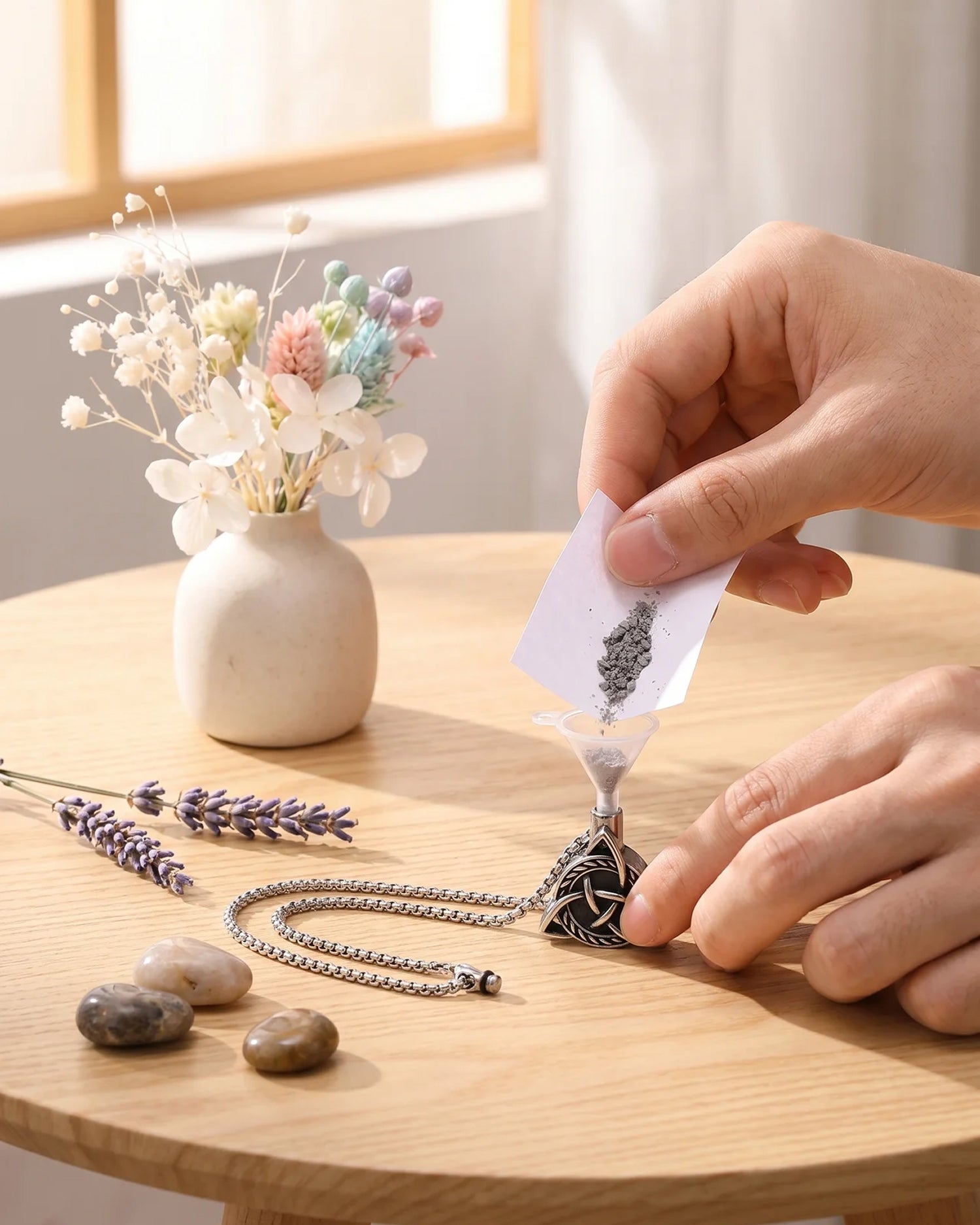 Filling Viking Trinity cremation necklace with ashes — threaded screw closure memorial pendant