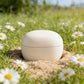Biodegradable clay cremation urn in nature — eco-friendly memorial urn for earth burial